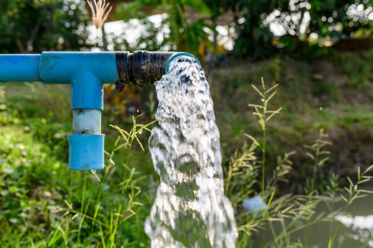 Water gushing out of a pipe