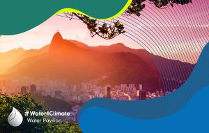 Buildings at the waterfront with Christ The Redeemer statue in the background, Corcovado, Rio de Janeiro, Brazil